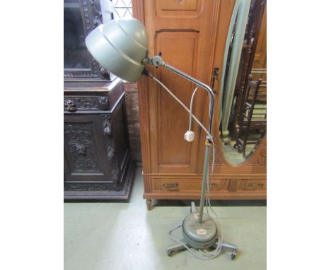A Haniovia Ltd "The Prescription - Model 7 Heat Lamp" with domed adjustable shade and stem, raised on tri-form supports