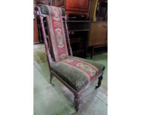 A Victorian mahogany prayer chair, with tapestry upholstered seat and back, raised on turned forelegs with brass caps and bro
