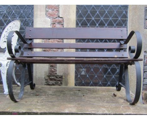 A two seat garden bench with sprung steel supports and timber lathes