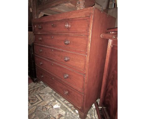 A 19th century mahogany caddy top bedroom chest of five long graduated drawers, with foliate capped turned knob handles, rais