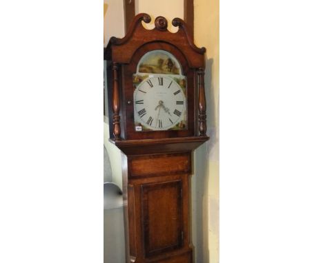 An early 19th century oak longcase clock with walnut crossbanding, the hood with turned column supports and swan neck frieze 