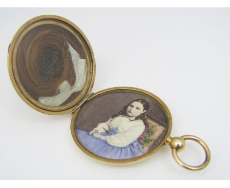 An engine turned picture locket containing a portrait and lock of hair, 4.4cm diameter, 27.9g