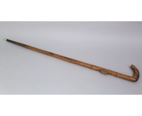 Interesting hardwood walking stick with carved moth/locust to the shaft