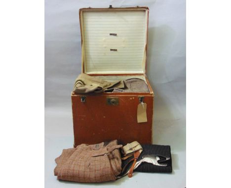 A travelling trunk filled with a collection of antique clothing including men's breeches dated 1915, pin stripe trousers date