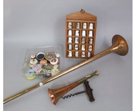 A copper coaching horn and 19th century corkscrew, together with a small wall cabinet containing thimbles and a number of pil
