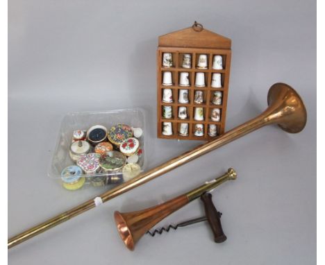 A copper coaching horn and 19th century corkscrew, together with a small wall cabinet containing thimbles and a number of pil