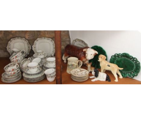 A large ceramic model of Hereford bull, a Cooper craft model of a Labrador and two further ceramic dogs, a quantity of 19th c