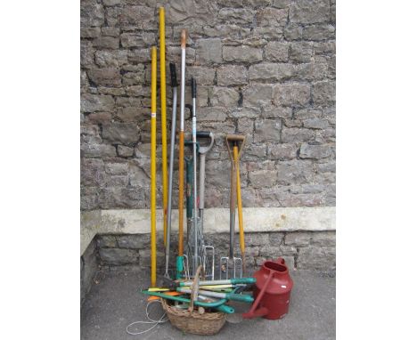 A collection of mainly contemporary long handled gardening tools