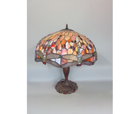 Tiffany style leaded glass lamp and stand, the shade decorated with geometric study of dragonflies and further cabochon glass