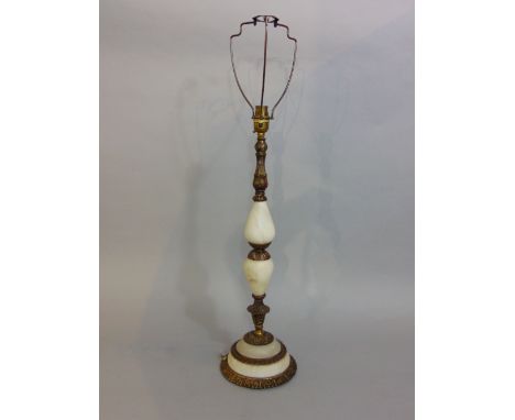A table lamp with cast brass framework and onyx panels