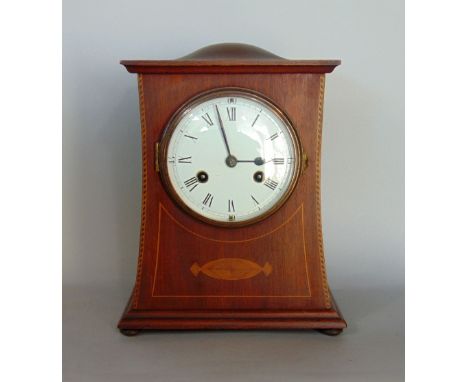 Early 20th century oak and box wood inlaid two train mantle clock, in shaped arts and crafts type case, the 5 inch enamel dia