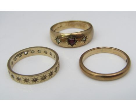 Three 9ct rings comprising a diamond and ruby set gypsy ring with two wedding rings, sizes N, P &amp; M, 9g total