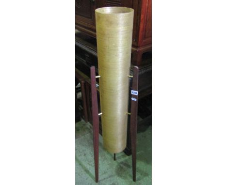 A mid 20th century rocket shaped floorstanding lamp with cylindrical shade and tapered teak supports