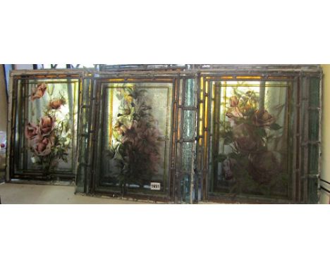 A set of eight Victorian leaded light panels each with individual botanical sprays set within wider geometric borders, averag