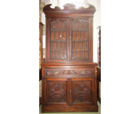 An Edwardian walnut secretaire bookcase, the upper recess section with architectural pediment over a pair of rectangular lead