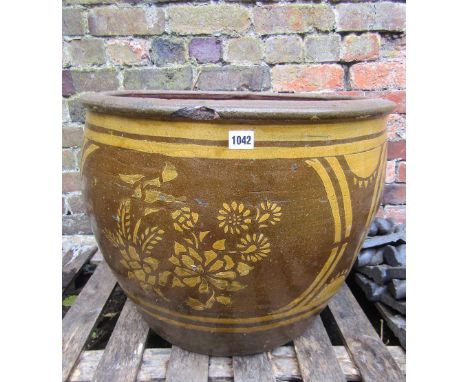 A contemporary brown and slip glazed jardiniere/planter of circular form with moulded rim and foliate detail, 60 cm diameter 