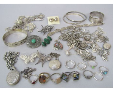 Collection of silver and white metal jewellery to include a sterling silver adjustable bangle, selection of rings, engine tur