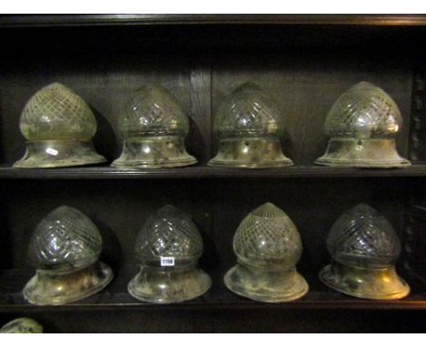 A set of eight good quality contemporary moulded glass pendant light fittings, with lattice and further detail, together with