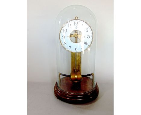 Bulle type electric mantle clock with brass column, enamel chapter ring with open workings, with swinging pendulum under glas
