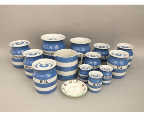 A collection of T G Green Cornishware blue and white banded kitchenwares including storage jars and covers for demerara sugar