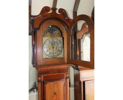 A substantial 19th century oak mahogany inlaid longcase clock, the hood with spiral column supports and swan neck frieze encl