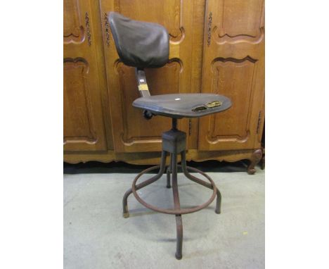 A vintage Evertaut industrial swivel adjustable typists/machinists chair with rexine upholstered pad seat and back raised on 