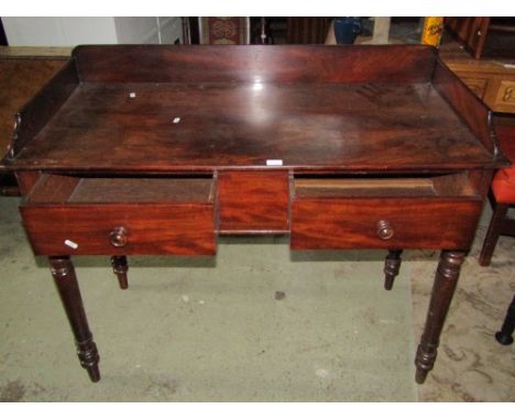 A 19th century mahogany washstand with shallow three quarter raised gallery over two oak lined frieze drawers raised on parti