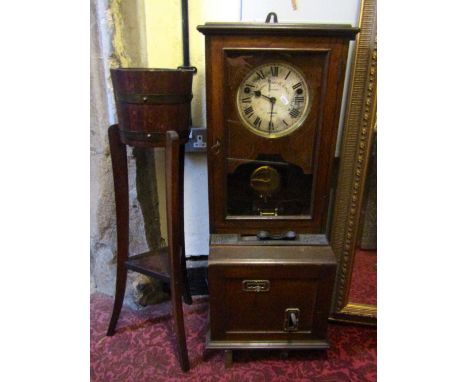 The Stockall Time Recorder with circular dial and oak case, together with a small Lister oak jardiniere stand with swept supp