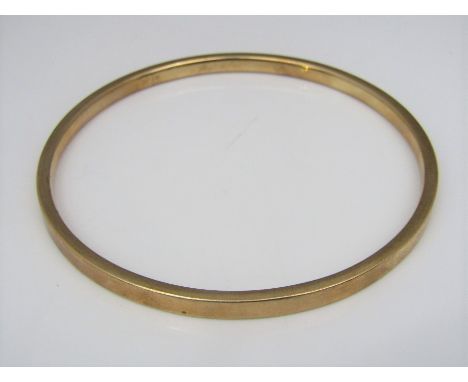 A 9ct bangle, 7.5cm diameter approx, 28g