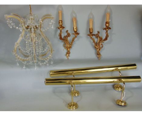 A mixed collection of lighting to include a prismatic drop chandelier, cast metal wall lights and two brass picture lights