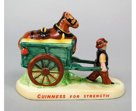 A Carlton ware Guinness advertising group of a cart horse resting in a wagon - Guinness for Strength, with printed and impres