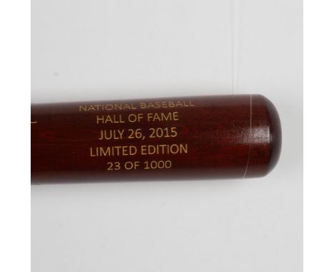 A beautiful, limited edition brown bat with gold etched logos and signatures of inductees, Craig Biggio, Randy Johnson, Pedro