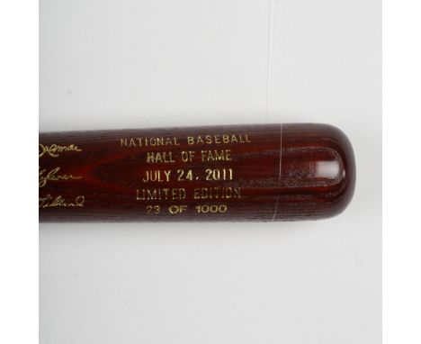 A beautiful, limited edition brown bat with gold etched logos and signatures of inductees, Roberto Alomar, Bert Blyleven and 