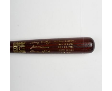 A beautiful, limited edition brown bat with gold etched logos and signatures of inductees, Umpire Hank O'Day, Jacob Ruppert, 