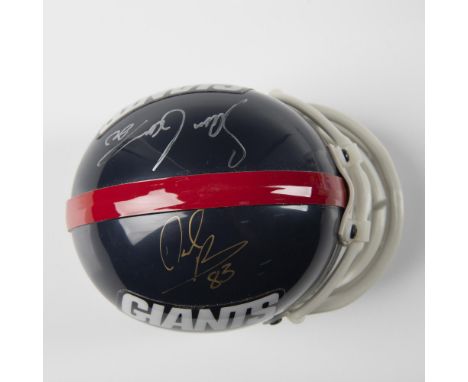 Riddell miniature, 3 5/8", autographed by the former defensive back (#20) and wide receiver (#83) in gold and silver sharpies