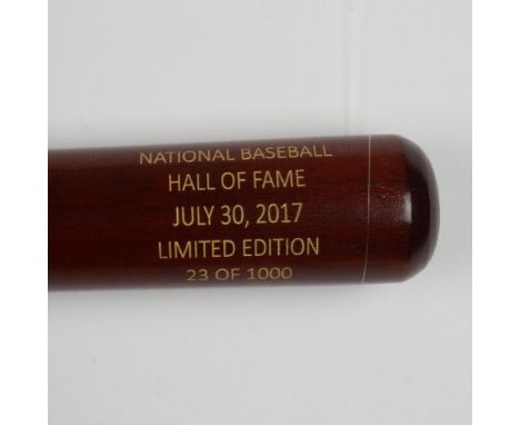 A beautiful, limited edition brown bat with gold etched logos and signatures of inductees, Jeff Bagwell, Bud Selig, Tim Raine