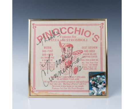 This is a framed pizza box top from Pinocchio's Restaurant in Media, PA signed by Randall Cunningham. Also included is a Rand