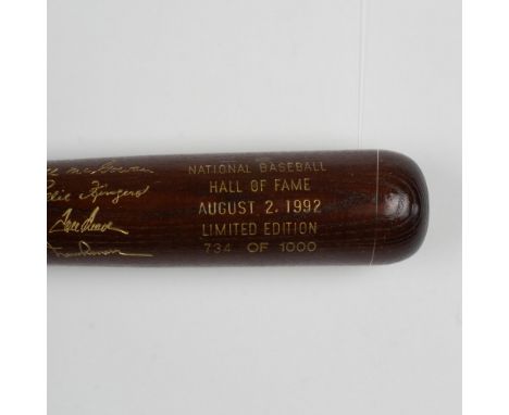 A beautiful, limited edition brown bat with gold etched logos and signatures of inductees, Tom Seaver, Rollie Fingers, Hal Ne