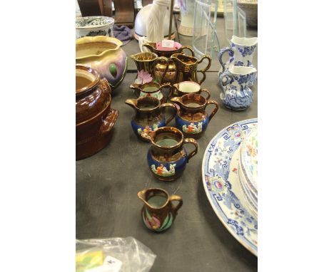 Selection of vintage hand painted copper lustre jugs
