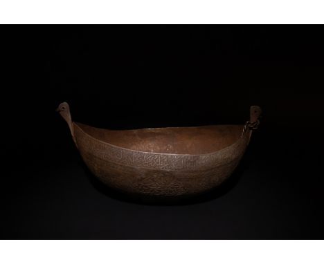 An Islamic Iron Kashkul Bowl, Inscribed with Islamic Calligraphy, Possibly Qajar.L: Approximately 29.5cm