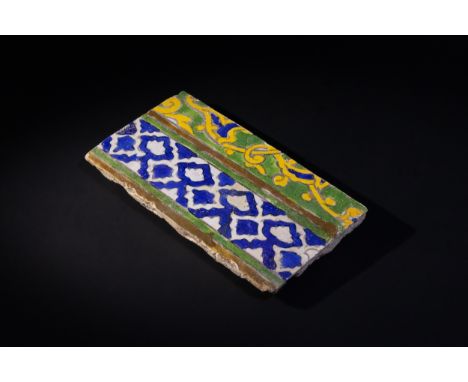 An Islamic Late Safavid Border Tile, 17-18th Century, Decorated with Floral, Geometric, or Arabesque Patterns.Approximately 2