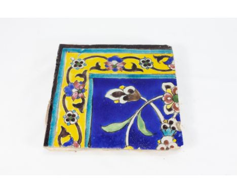 An Islamic Zand Blue Ceramic Tile. 18th Century.Approximately 18.7cm x 19.6cm