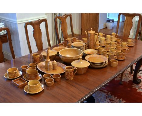 An extensive Portmeirion Totem pattern dinner service designed by Susan William Ellis, in ochre glaze, comprising an oval pla