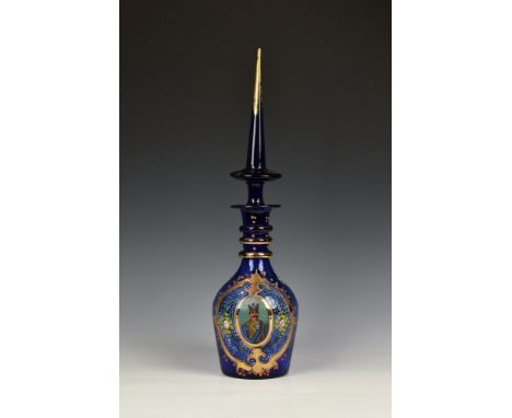 A Bohemian Persian cobalt blue and enamel decanter, probably mid 20th century, with triple ring neck and elongated spire stop
