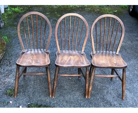 Ercol - Lucian Ercolani - a set of three mid century Utility beech and elm Windsor dining chairs 1945-53, the hoop backs with