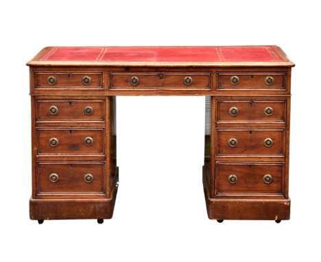 A mid-19th century mahogany twin pedestal desk the moulded top with inset red gilt tooled leather, over three frieze drawers 