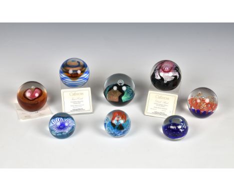 A collection of Caithness and other glass paperweights to include Inner Circle; Dark Secret; Eternity; Petunias, and four oth