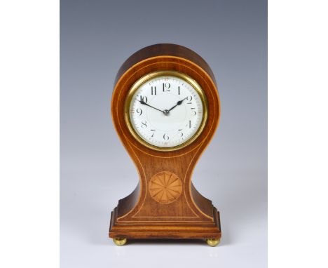 An Edwardian inlaid mahogany mantel clock the balloon case with boxwood stringing and fan patera, on gilt brass ball feet, th