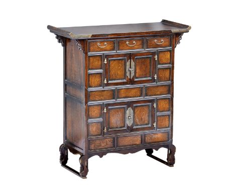 A Korean hardwood scholars chest with a rectangular top over three short drawers and two doors revealing storage to the top s