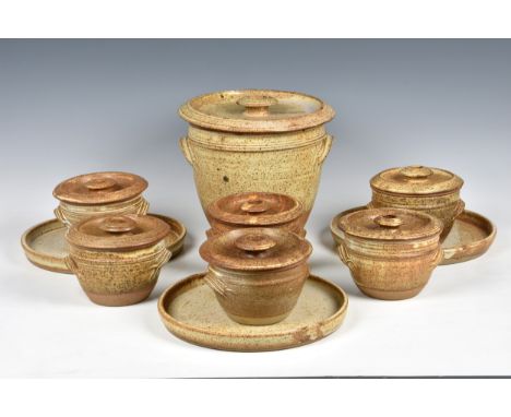 A Guernsey bean jar set by Moulin Huet Pottery comprising a bean jar crock with cover, three plates and six covered bean jar 